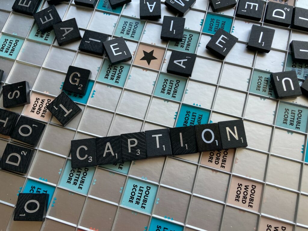 a close up of a scrabble tile wall with words written on it